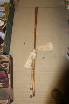 A three piece cane fishing rod with carry bag