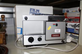 A Cinerex film projector with original box