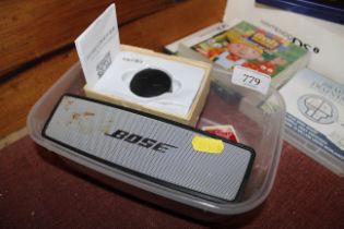 A Bose SoundAlike mini speaker, GPS tracker with o