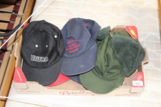 A box of various hats, caps etc.