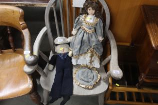 A Victorian style doll and a knitted sailor doll