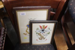 Two framed and glazed hand painted crests