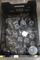 A box containing various table glassware