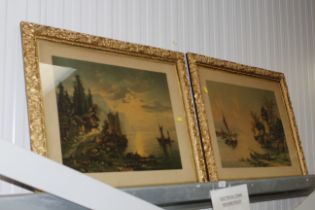 A pair of gilt framed prints depicting two lake sc