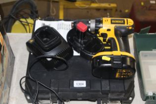 A DeWalt DC725 cordless electric drill with spare