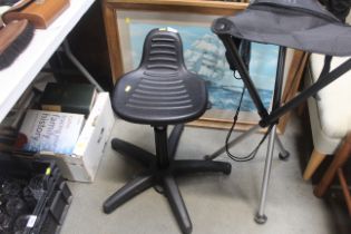 An adjustable workshop stool