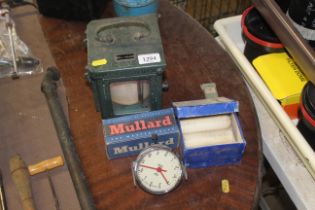 A boxed barometer, reading lamp, candles in origin