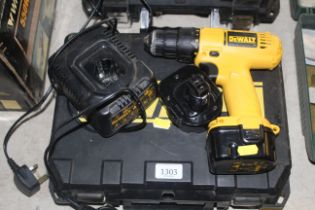A DeWalt DW907 cordless electric drill with spare