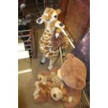 A quantity of soft toy animals to include giraffe,