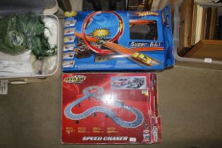 A Hot Wheels Super Six-in-One race course and a Fa