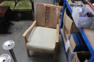 A carved back and strung backed armchair