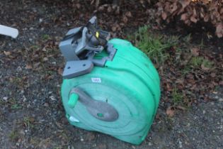 A hose lock; a hose reel container and fittings