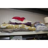 A quantity of various blankets, pillows, material