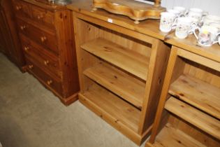 A pine three tier adjustable open fronted bookcase