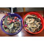 Two plastic tubs of various costume jewellery