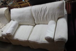 A floral upholstered two seater settee