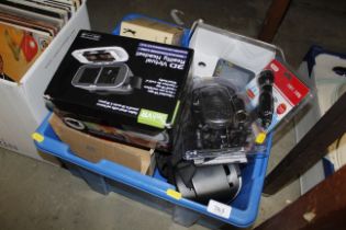 A box of various electrical items to include radio