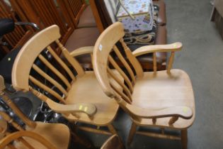 A pair of beech slat back carver chairs