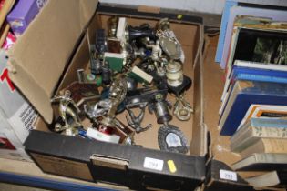 A box containing various trophies, awards, cups et