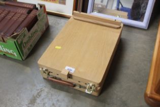 An artists travelling box/table top easel and cont