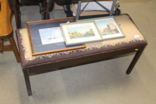 A needlework upholstered piano stool