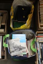 A bag containing various railway magazines and a f