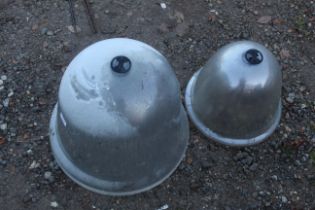 A quantity of various sized plastic cloches