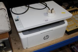 An HP LaserJet M140W printer/scanner