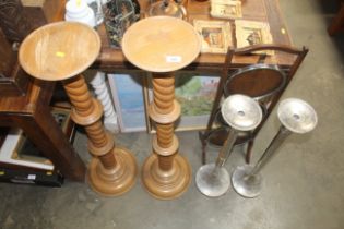 Two wooden plant stands with barley twist supports