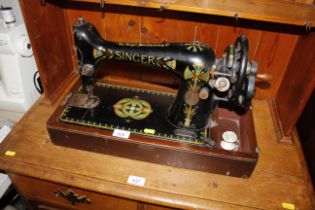 A Singer hand sewing machine, lacking lid