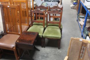 A set of four carved back green upholstered Edward