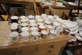 A quantity of commemorative mugs