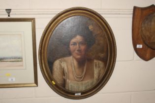 An oval gilt framed oil portrait study of a female