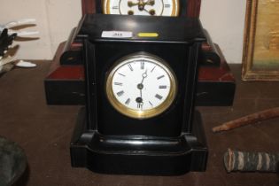 A Victorian single hole mantle clock contained in