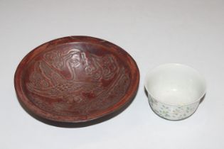 An Oriental floral decorated tea bowl having six