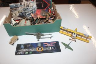 A box of various Star Wars toys and other items