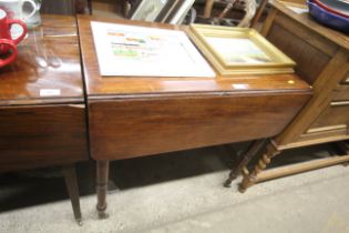 A 19th Century mahogany Pembroke table raised on t