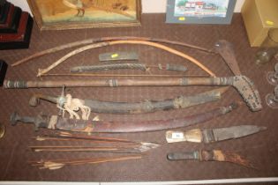 A collection of various weapons including curved d