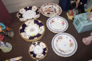 A collection of Coalport blue and gilt dinner and