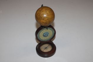 A Newton's New and Improved terrestrial globe on stand, the base fitted with a compass, 23cm high