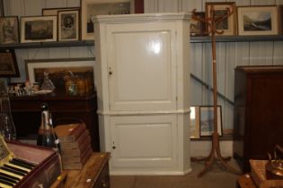 A large Victorian white painted pine corner cupboa