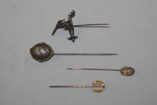 Two 9ct gold stick pins and two other stick pins