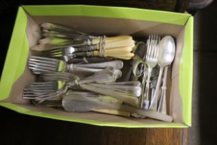 A box of various silver plated flatware