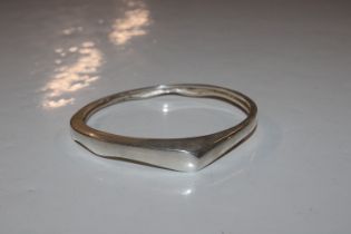 A hallmark sterling silver modernist bangle, appro