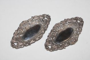 A pair of oval pierced silver dishes