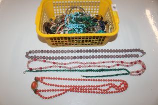 A box of jewellery including various bangles; bead