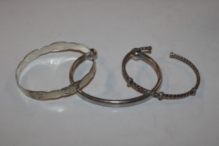 Three solid silver bangles, approx. 37gms total we