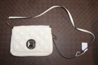 A Kate Spade cream shoulder bag