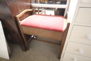 An Edwardian mahogany inlaid piano stool