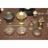 A collection of metalware to include pestle and mortar; hand bells; candle stands etc